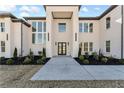 Elegant entryway with a modern door and landscaping at 1682 Union Grove Church Rd, Auburn, GA 30011