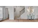 Modern staircase with metal railing and light gray walls at 20 Jacobs Farm Ln # 10, Lawrenceville, GA 30045