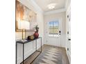 Light and airy entryway with white door and console table at 24 Jacobs Farm Ln # 12, Lawrenceville, GA 30045