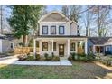 Inviting two-story house with a cozy front porch, perfect for enjoying the outdoors at 2715 Memorial Se Dr, Atlanta, GA 30317