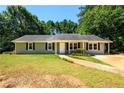 Charming single-story home with a well-maintained lawn and inviting curb appeal at 780 Navajo Trl, Covington, GA 30016