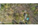 House nestled in wooded lot with a pool at 380 Stone Rd, Mcdonough, GA 30253