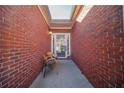 Brick entryway with two chairs and access to garage and home at 4976 Centennial Hill Walk Nw Dr, Acworth, GA 30102