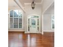 Bright entryway with hardwood floors, arched windows and a glass front door at 305 Mogie Ln, Acworth, GA 30102
