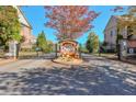 Gated community entrance with autumnal decorations at 2005 Heathermere Way, Roswell, GA 30075