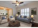Spacious living room with hardwood floors and a view to the dining area at 2005 Heathermere Way, Roswell, GA 30075