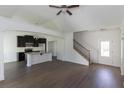 Open concept living room with kitchen and staircase at 160 Eryn Ter, Covington, GA 30014