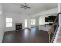 Spacious living room with hardwood floors, fireplace and open concept at 160 Eryn Ter, Covington, GA 30014