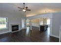 Open living room with fireplace and kitchen views at 130 Eryn Ter, Covington, GA 30014