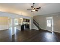 Open living space, kitchen, and staircase view at 130 Eryn Ter, Covington, GA 30014