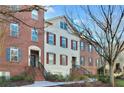 Brick townhomes with multiple windows and a landscaped path at 879 Perennial Dr, Sandy Springs, GA 30328