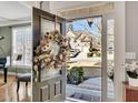 Welcoming front door with glass and a view of the home across the street at 3641 Carriage Glen Way, Dacula, GA 30019