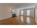 Hardwood floors and a fireplace are featured in this living room at 14 Newport Nw Pl, Atlanta, GA 30318