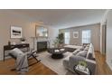 Spacious living room with hardwood floors, fireplace, and neutral decor at 14 Newport Nw Pl, Atlanta, GA 30318