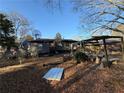 Backyard with patio and partially covered deck at 224 Hollis St, Rutledge, GA 30663