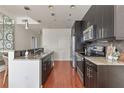 Modern kitchen with stainless steel appliances and granite counters at 1080 Peachtree St # 2406, Atlanta, GA 30309