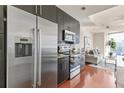 Modern kitchen with stainless steel appliances and granite counters at 1080 Peachtree St # 2406, Atlanta, GA 30309