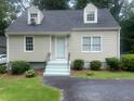 Beige house exterior with gray roof, steps, and green landscaping at 2351 Johnson Ferry Ne Rd, Chamblee, GA 30341