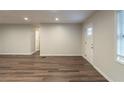 Bright living room showcasing new laminate flooring, fresh paint, and ample natural light at 3881 Bonnie Se Ln, Atlanta, GA 30354