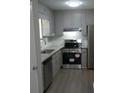 Renovated kitchen with granite countertops and stainless steel appliances at 5112 Central Church Rd, Douglasville, GA 30135