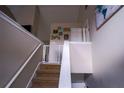 Bright staircase featuring neutral walls, white trim, and a safety gate at 1469 Harmony Grove Church Rd, Auburn, GA 30011