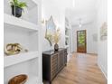 Bright entryway with built-in shelving and a modern console table at 1211 Stephens Se St, Smyrna, GA 30080