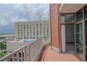 This balcony features brick flooring and a view of the city buildings at 250 Park Avenue West Nw # 903, Atlanta, GA 30313