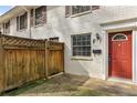 Brick townhouse with red door and a wood fence at 771 Jordan Ln # F, Decatur, GA 30033