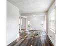 Spacious living room with hardwood floors, large windows, and white walls at 1380 Westmont Sw Rd, Atlanta, GA 30311