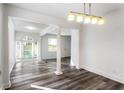 Bright living area with hardwood floors, recessed lighting, and large glass doors at 1380 Westmont Sw Rd, Atlanta, GA 30311