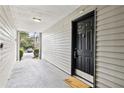 Covered entryway with black door and 