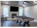 Game room with pool table, fireplace, and hardwood floors at 2914 Battlecrest Dr, Decatur, GA 30034