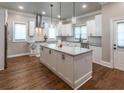 Gourmet kitchen featuring white cabinets, granite counters, and hardwood floors at 2914 Battlecrest Dr, Decatur, GA 30034