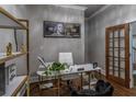 Home office with marble desk, gold accents, and hardwood floors at 2914 Battlecrest Dr, Decatur, GA 30034