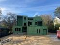 View of a modern home under construction, showing the frame and exterior sheathing at 3534 Rockhaven Ne Cir, Atlanta, GA 30324