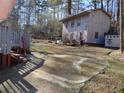 Large backyard with a wooden shed and a deck at 3566 Carry Ct, Snellville, GA 30039