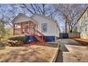 Newly renovated home with a driveway and front yard at 953 Garibaldi Sw St, Atlanta, GA 30310