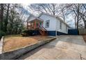 Home featuring a welcoming front porch and long driveway at 953 Garibaldi Sw St, Atlanta, GA 30310