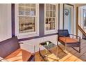 Relaxing front porch with wicker chairs and a small table at 953 Garibaldi Sw St, Atlanta, GA 30310