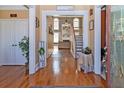Bright and spacious entryway with hardwood floors and view of the living room at 1553 Rolling Meadows Dr, Mcdonough, GA 30253