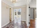 Elegant entryway with marble flooring and access to other rooms at 213 Pine Crest Dr, Cumming, GA 30040
