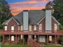 House with a large deck and stairs leading to the backyard at 3071 N Tower Ne Way, Conyers, GA 30012