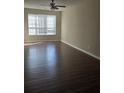 Spacious living room with a ceiling fan and hardwood floors at 11329 Michelle Way, Hampton, GA 30228