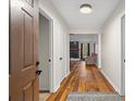 Bright entryway with hardwood floors leading to living room at 7037 Shangrila Trl, Riverdale, GA 30296