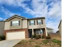 Two-story house with attached garage and front yard at 3306 Loblolly Pine Way, Decatur, GA 30034