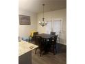 Dining room with chandelier and dark wood table and chairs at 5396 Pennington Court, Atlanta, GA 30349