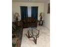 Living room with elegant sofas and glass coffee table at 5396 Pennington Court, Atlanta, GA 30349