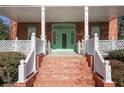 Brick steps leading to a charming green front door at 764 Edgewood Ne Ave # 8, Atlanta, GA 30307