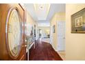 Inviting home foyer featuring hardwood floors, chandelier and decorative console table at 3377 Fielders Point, Dacula, GA 30019