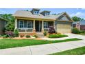 Beautiful home featuring a lovely porch and lush landscaping, creating curb appeal at 221 Aster Ct, Canton, GA 30114